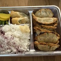 Age (fried) gyoza bento. Spaghetti noodles and potatoes are under the gyoza  at KAMINARI GYOZA in Los Angeles