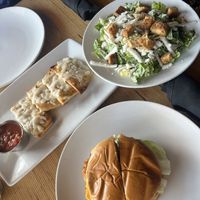 garlic bread, Cesar salad and “chicken” sandwich - tastes like what i remember of mcdonald’s   at Vegan & Vine in Phoenix