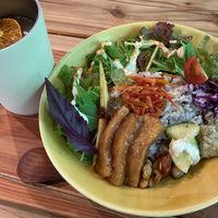 Buddha bowl and orange drink.  at ne - Plant-based Cafe & Act in Yakushima