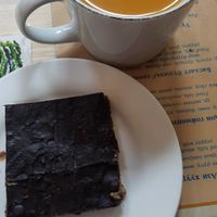 Vegan gluten-free caramel slice; Hot seabuckthorn juice at The Oneness Fountain Heart Vegan/Vegetarian Cafe in Ulaanbaatar