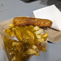 Battered sausage with chips and curry sauce. £7. at The Food Studio @ ChippyLane in Cardiff