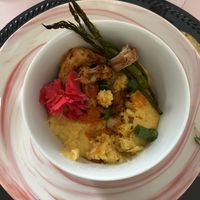 Vegan shrimp and grits with bacon wrapped asparagus  at All Purpose Vegan in Atlanta