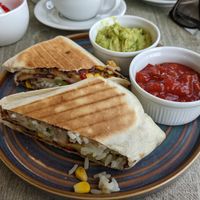 A tasty bean, corn, rice and salad burrito, with tomato salsa and guacamole for £8.00. Much better value and nutritious at Bay View Garden Centre & Restaurant in Carnforth