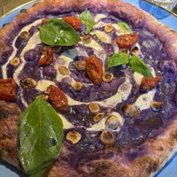 Pizza con crema di cavolo viola, Tofu alle erbe, briciole di nocciola, pomodorini confit  at Dinner in Legnano