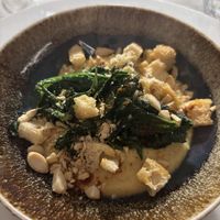 Hummus di ceci, cime di rapa ripassate, mandorle tostate, polvere di paprika e crostini di pane  at Dinner in Legnano