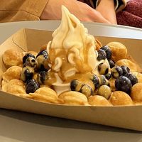 Vegan waffle with blueberries and caramel sauce   at YOMARO in Luebeck