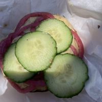 Bagel w hummus, cucumber, & pickled onion. Delicious   at Coffeetopia in Santa Cruz