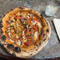 Robert Mark: Pepper, capricosa and olive paste and vegan cheese.  at Al Catzone Pizza Napovegana in Berlin