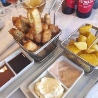 Berenjena en tempura con sirope y soja. Patatas bravas. at Hibiscus Can Fisa in Corbera De Llobregat