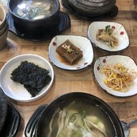 Tofu and Mushroom Jigae with side dishes. Reccomend not to consume side dishes (excepted seaweed) as it is unconfirmed if there are animal products inside   at Ilpum Soft Tofu  in Jeju