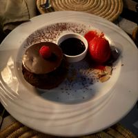 Vegan chocolate cake with chocolate sauce and raspberry ice-cream  at Nomad in Marrakech