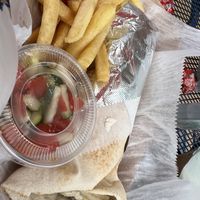 Falafel pita with a side of fries and cucumber tomato freshie salad.  at Celo's in Melbourne