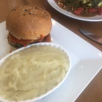 Eggplant Pathan sandwich with smashed yucca and biscuit with Avocado, cilantro and gravy  at Full Taste in Chamblee