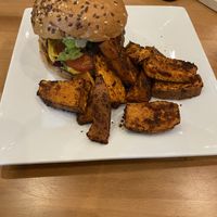 Another take of the burger and sweet potato wedges. Comes with a smoky handcrafted cheese.   at Full Taste in Chamblee
