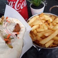 Falafel pocket, chips, NORMAL Coke and plastic-based plant (vegan). Delish AF! #chipstho at Falafel Omisi in Caulfield