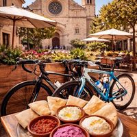 Our sunny terrace next to the 18th-century church in Santa Maria del Camí. Perfect for brunch with a view. at Deli - Santa Maria in Mallorca