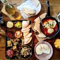 Breakfast 2.0 for two — our signature morning sharing plate with meze, eggs, fresh dips, pita and Shaksuka plate. Made from scratch daily at Deli Santa Maria. at Deli - Santa Maria in Mallorca