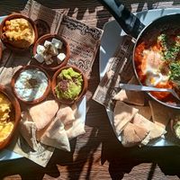 Breakfast  — meze, eggs, fresh dips, pita and also a Shaksuka plate. Made from scratch daily at Deli Santa Maria. at Deli - Santa Maria in Mallorca