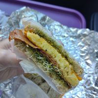 Yummy vegan breakfast sandwich which included sprouts! Nice touch. at East Park Donuts and Coffee in Nashville