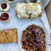 Strawberry rhubarb jammers, pistachio pull-apart bread, hazelnut baklava (oh my!), and maple pecan sticky bun  at Organicos Bakery in Phoenix