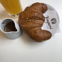 vegan croissant, coffee and juice  at Vergani in Milan