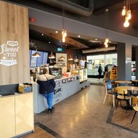 Inside lots of seating at Esquires Coffee  in West London