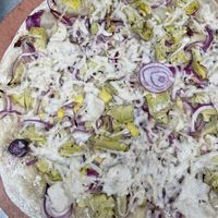 light bake (take & bake) pizza with cashew cheese & veggies  at Arizmendi Bakery and Pizzeria in Emeryville