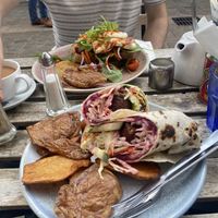 falafel & tahini wrap with potato skins. grilled halloumi on sourdough in background  at Chapters in Durham