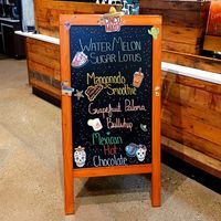 Sandwich board inside at Wild Pony Coffee Co in Evansville