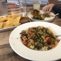 Foreground: rice bowl (I mixed it up before remembering to take a picture). Tacos and chips and salsa    at Wild Taco in Denver