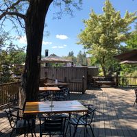 Outdoor seating area under the trees! 🌲😍  at Jupiter in Winthrop