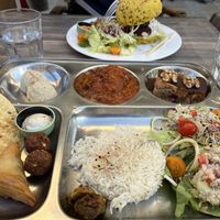 Asian platter at front, burger and brochettes at rear  at Le Shanti in Dijon