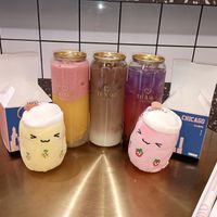 Sunrise slushie, oolong milk tea, and lemonade sandwiched between cute plushes at Te'amo Boba Bar in Chicago