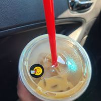 Large Iced Vanilla Honey Latte with Oatmilk and light ice at Scooter's Coffee in Springfield