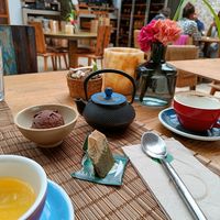 Chocolate vegan ice cream and tea. And an empty cup of cappuccino with oat milk. at The Giri Café in Ibiza