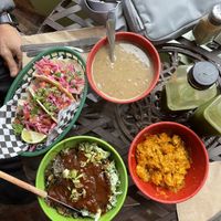 Street tacos, black bean soup, bbq portobello with collards and broccoli salad, butternut squash sweet potato smash and green juice  at Green Door Cafe in Astoria