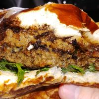 Cherry Chocolate BBQ Burger cut in half. So much flavor!! at Native Foods in Tigard