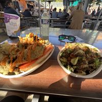 Bomb fried Brussel salad (right) oily crispy savory seasoned perfection. Football sized tempura portobello mushroom pooboy sandwich (left) massive 4 handed mess, very good    at The 05 in Greenville