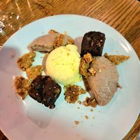 Beet Brownie with red bean mousse, Pineapple orange sherbert, coconut cookie crumble at Nola in Winnipeg