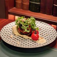 Vegan Whole Roasted Portobello Mushroom with Sun-Dried Tomatoes, Onion, Sumac Spice served with Butterbean Mash at Cultivate Cafe in Central Singapore