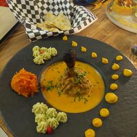 Tandoor 'chicken' on a wooden 'bone' at Késarum in Southampton