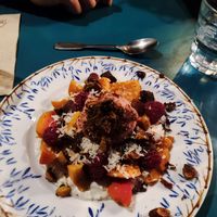 Dessert: Coconut creme with fruits, caramelised nuts and ice creme at Mariposas in Marseille