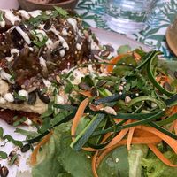 Galette de maïs, aubergine, houmous sauce végétal et graines avec une salade de carottes et de courgettes   at Mariposas in Marseille
