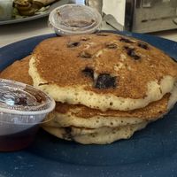 Vegan Blueberry Pancake Stack comes w three pancakes and includes a flavor type (blueberry here) served with table syrup   at Mattie's Diner in Charlotte