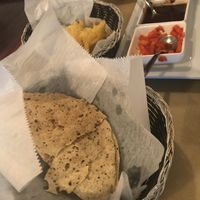 Pappadums and chutneys (green one is non-vegan)  at Turmeric House in Weymouth