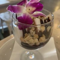 Coconut pudding with chocolate syrup   at Kau Kau in Sacramento