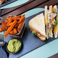Club sandwich with sweet potato fries and guacamole. at Ma'Rinas - Veggiezz in Karlsruhe