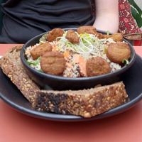 Quinoa salad with sweet potato, other veggies and falafel. Served with bread. at Hortus Grand Cafe in Leiden