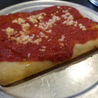 Undercooked crust, raw garlic and oil. at Via 313 Pizza in Cedar Park