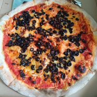 Black olives and dried tomatoes at Pizza Z Piecca in Warsaw